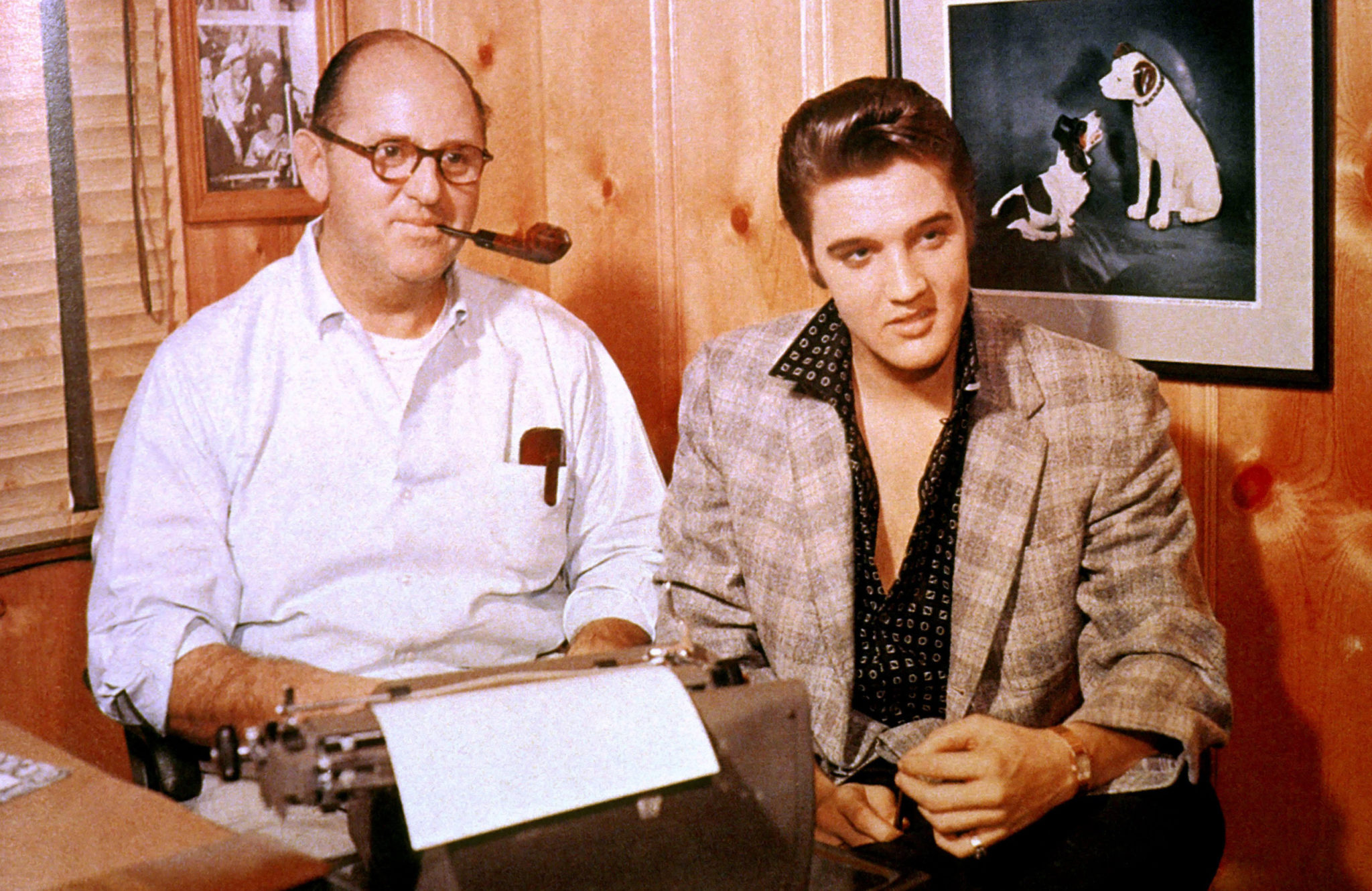 Colonel Tom Parker and Elvis Presley in October 1955 signing a record contract with RCA Victor. *** USA ONLY *** © Glenn A. Baker / Redferns / Retna Ltd.
